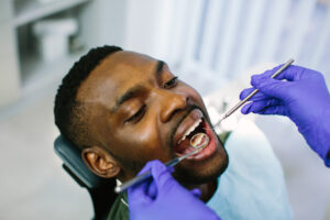 man receiving preventive dentistry in Grand Prairie